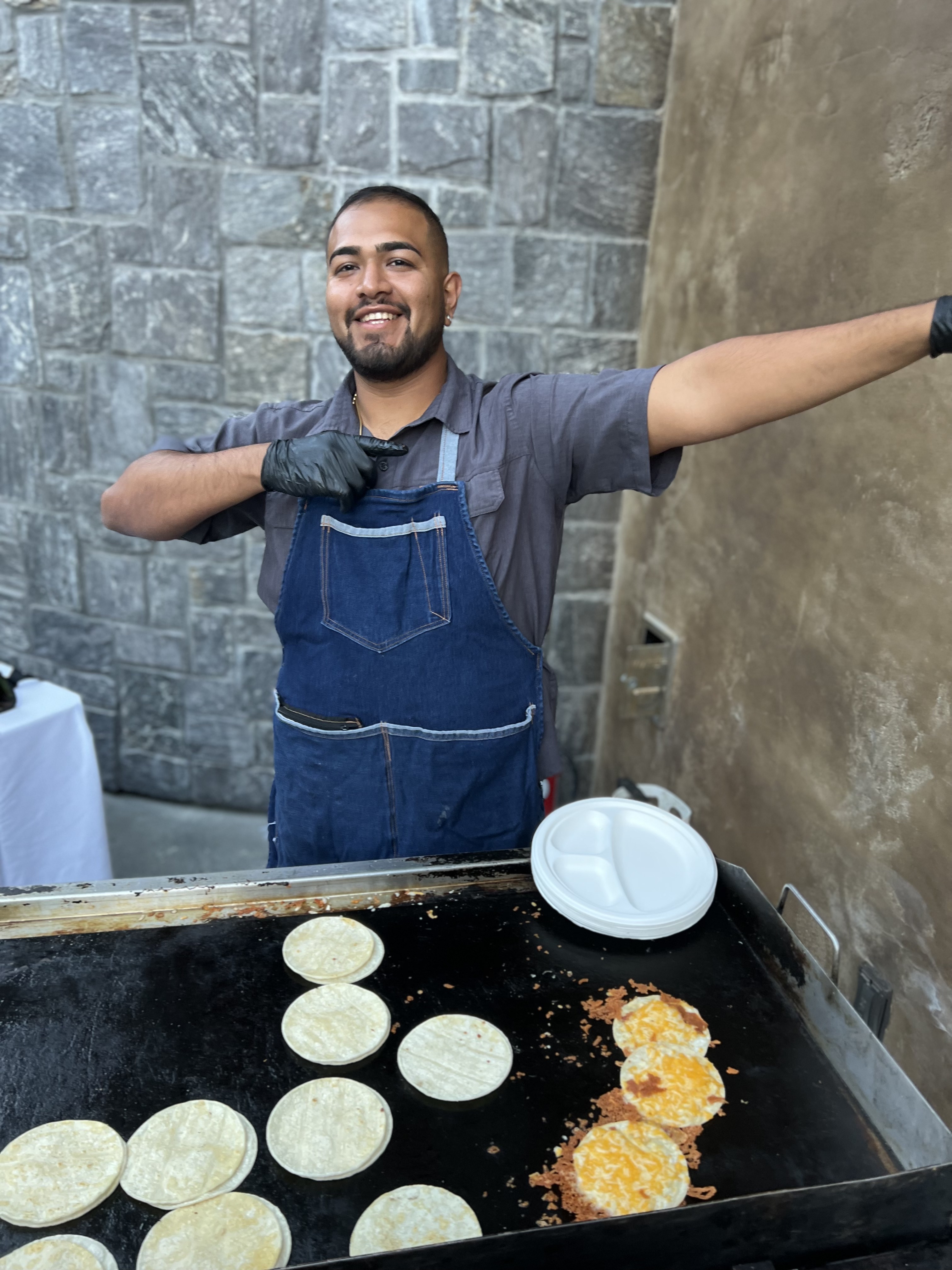 Taqueria 805 crew cooking on the flat-top grill